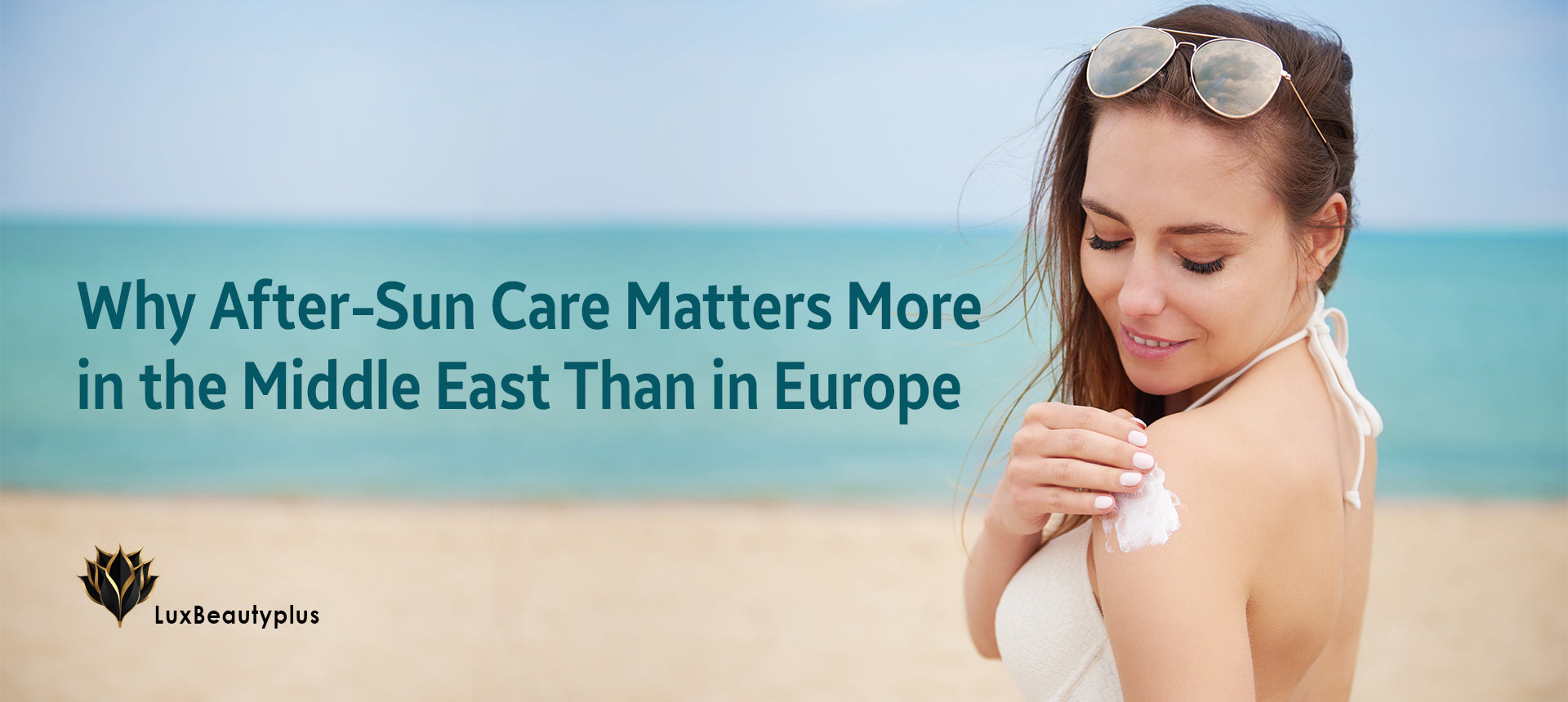 A woman on a sunny beach applies soothing after-sun lotion to her shoulder, highlighting the importance of skin hydration and recovery after sun exposure. The LuxBeautyPlus logo appears in the corner.